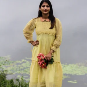 Naturally dyed golden yellow Kota dress with madder peach collar and floral embroidery