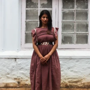 Twilight Berry mul cotton dress with lace-trimmed ruffled sleeves and smocked chest, naturally dyed with sappan wood